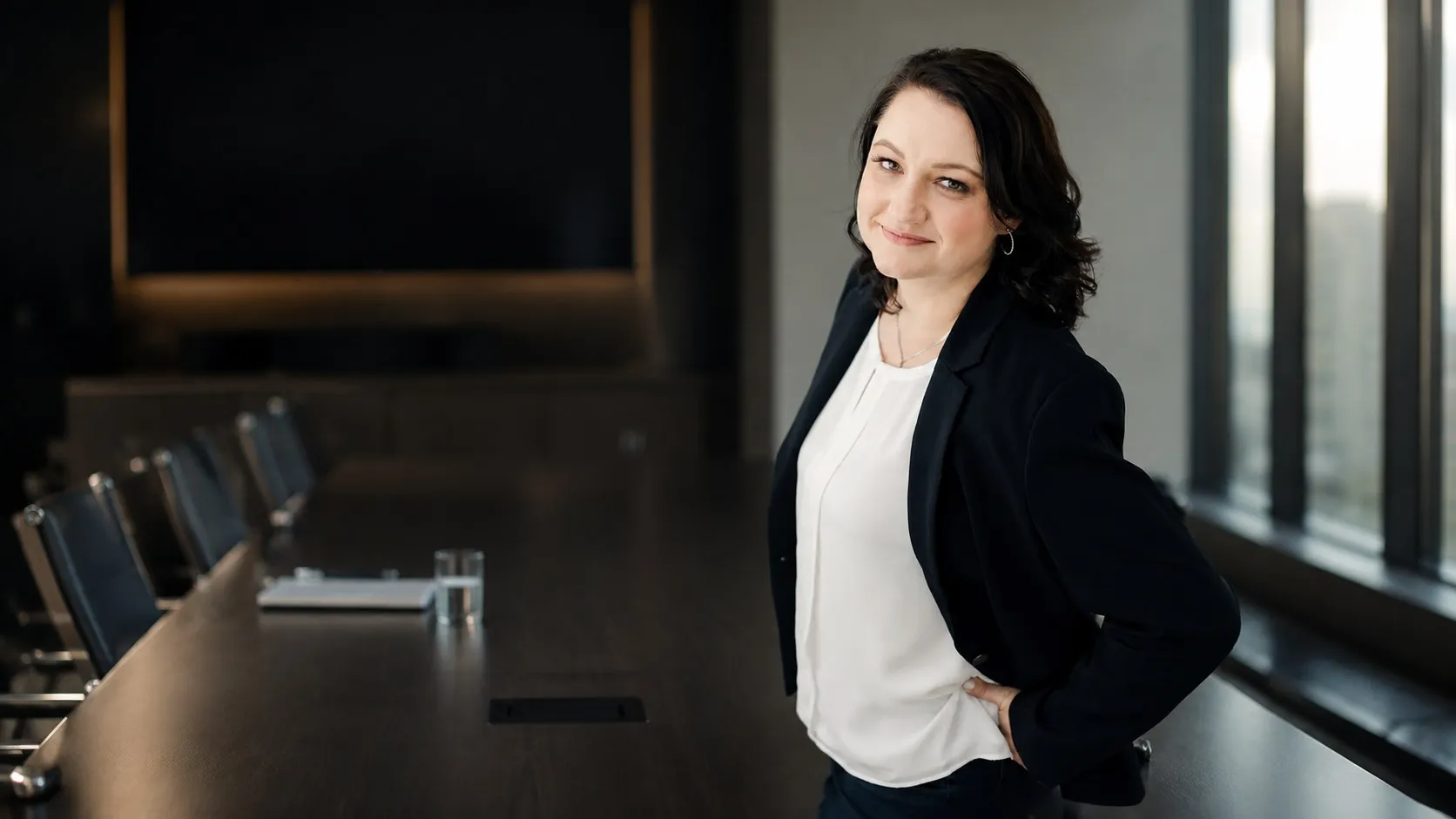 Annelize du Toit standing at the head of a boardroom table